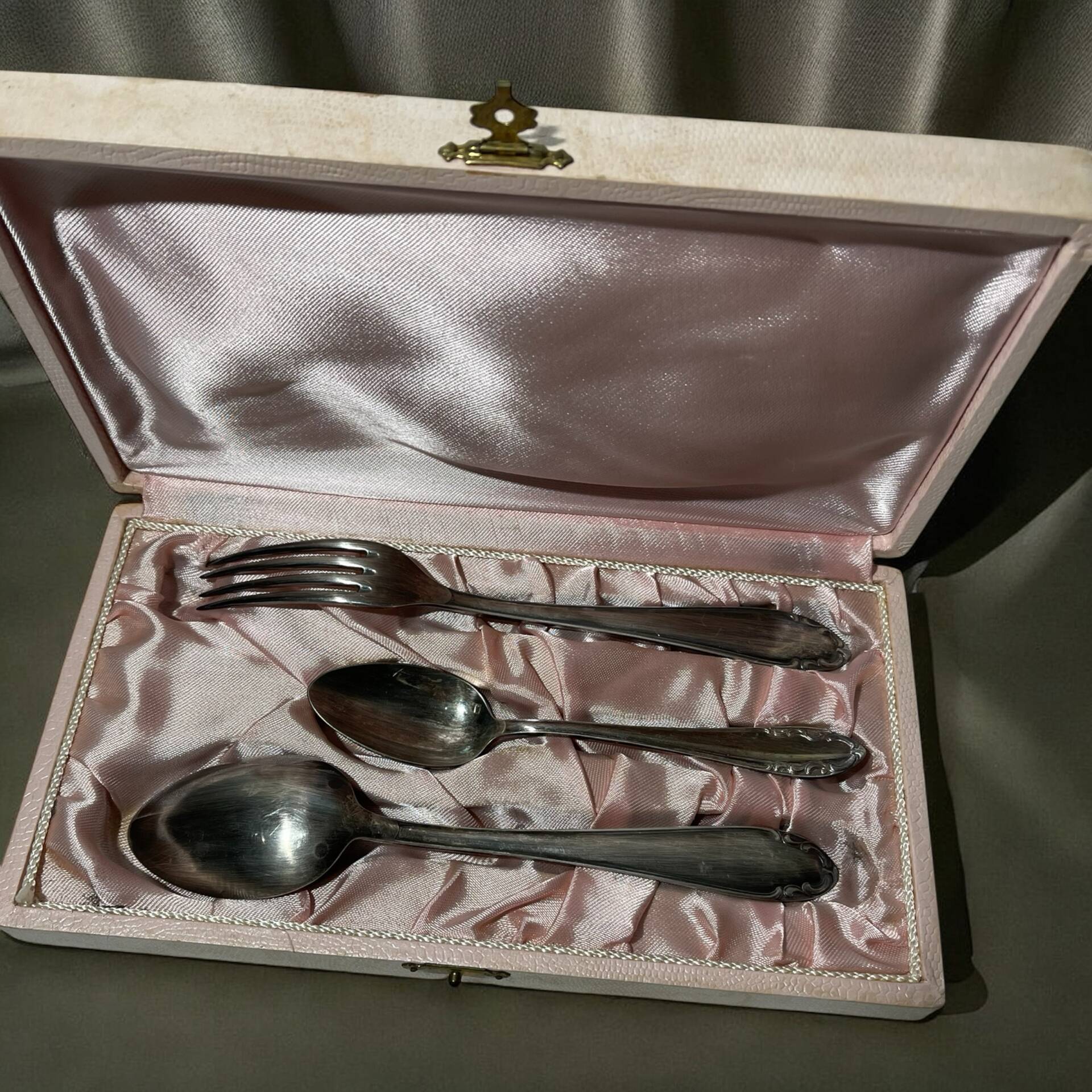Set of antique silver-plated cutlery for children.