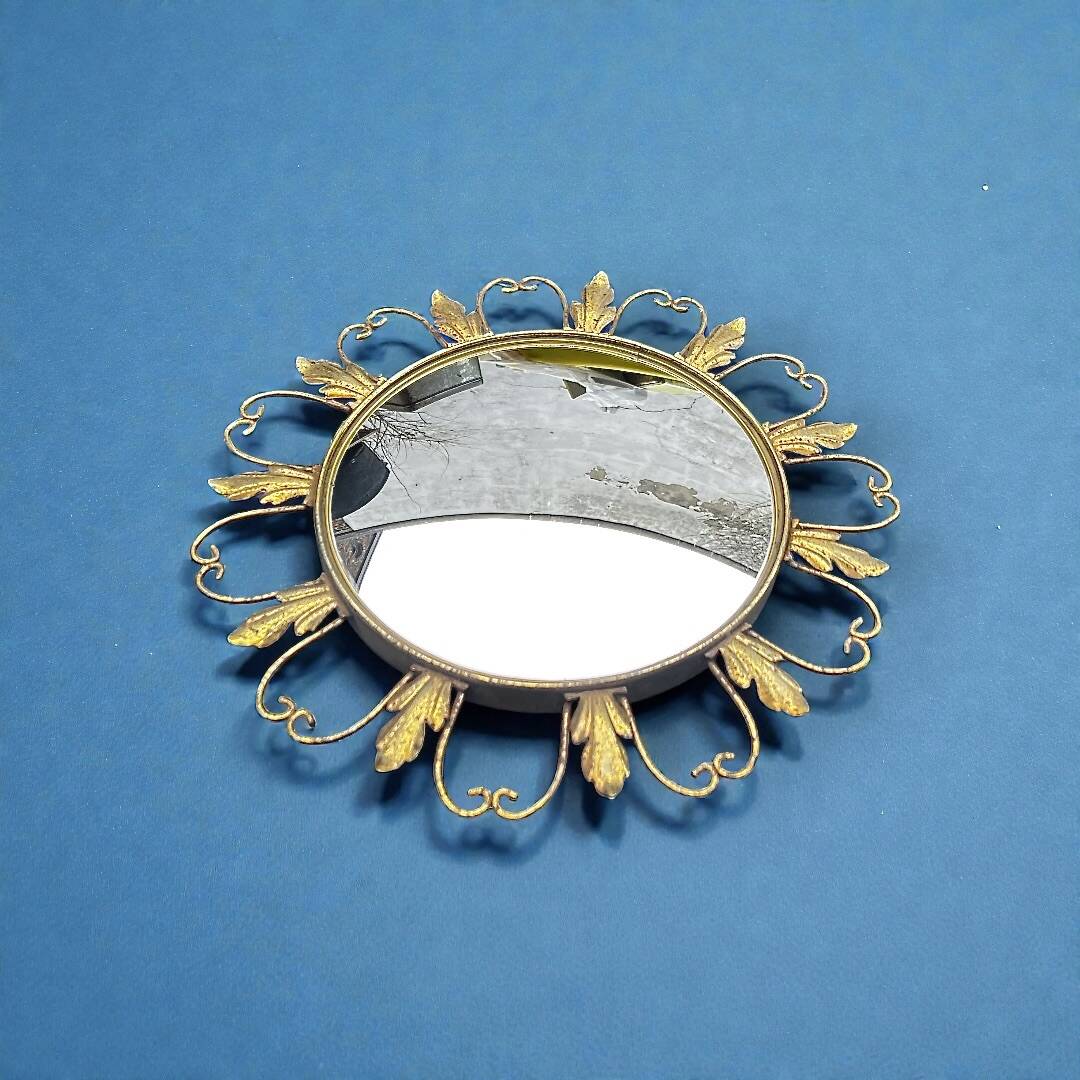 Circular gold metal mirror with floral decoration – 1960s