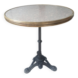 Genuine round bistro table, cast iron legs, brass rim