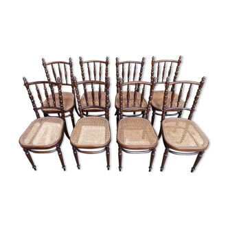 Suite de 8 chaises de bistrot en cannage FISCHEL