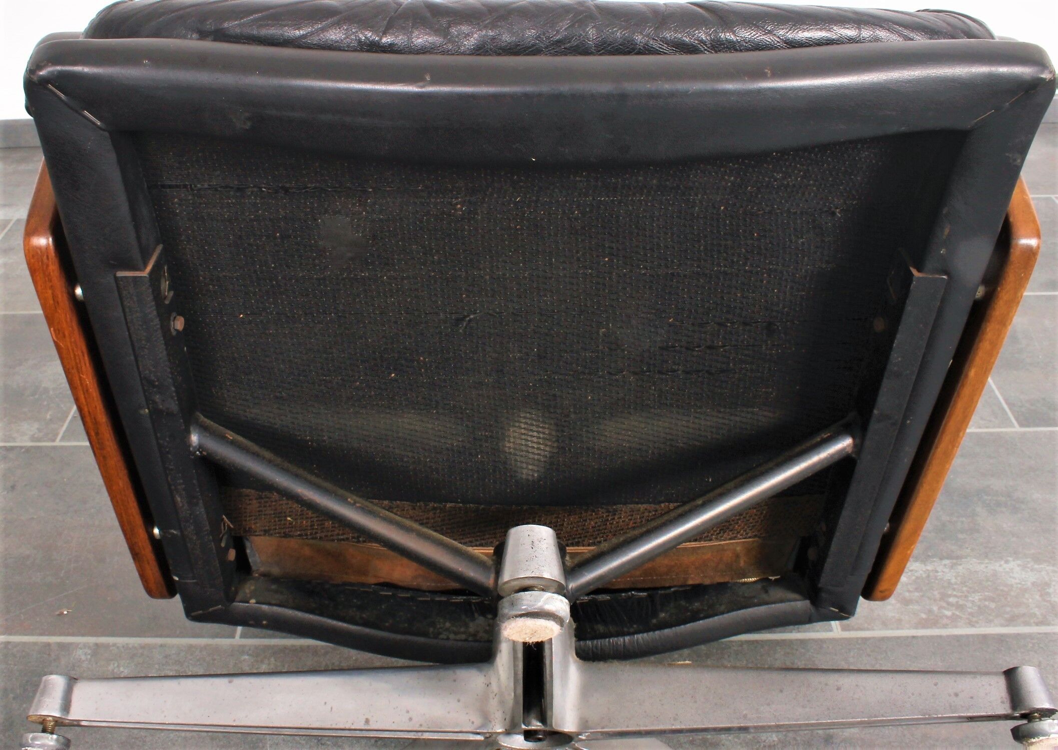 Armchair and footstool by André Vandenbeuck for Strässle in black leather