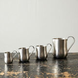 Set of 4 vintage bar measures in brushed stainless steel from the 60s-70s.