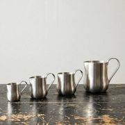 Set of 4 vintage bar measures in brushed stainless steel from the 60s-70s.