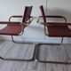B34 armchairs, cognac leather and gilding