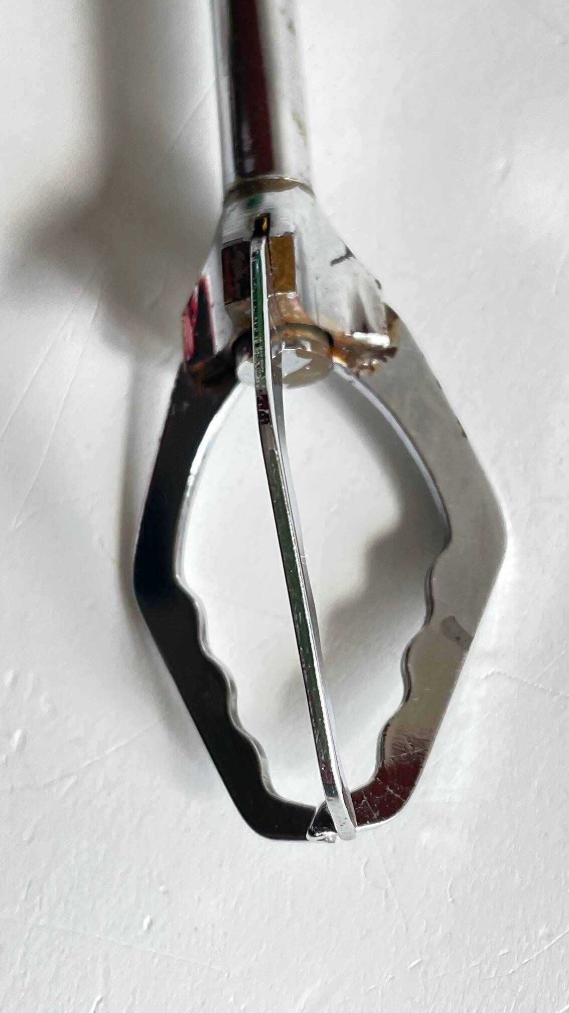 Long vintage chrome metal sugar tongs