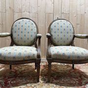 Pair of cabriole armchairs with medallion backs from the Louis XVI period, stamped OT.