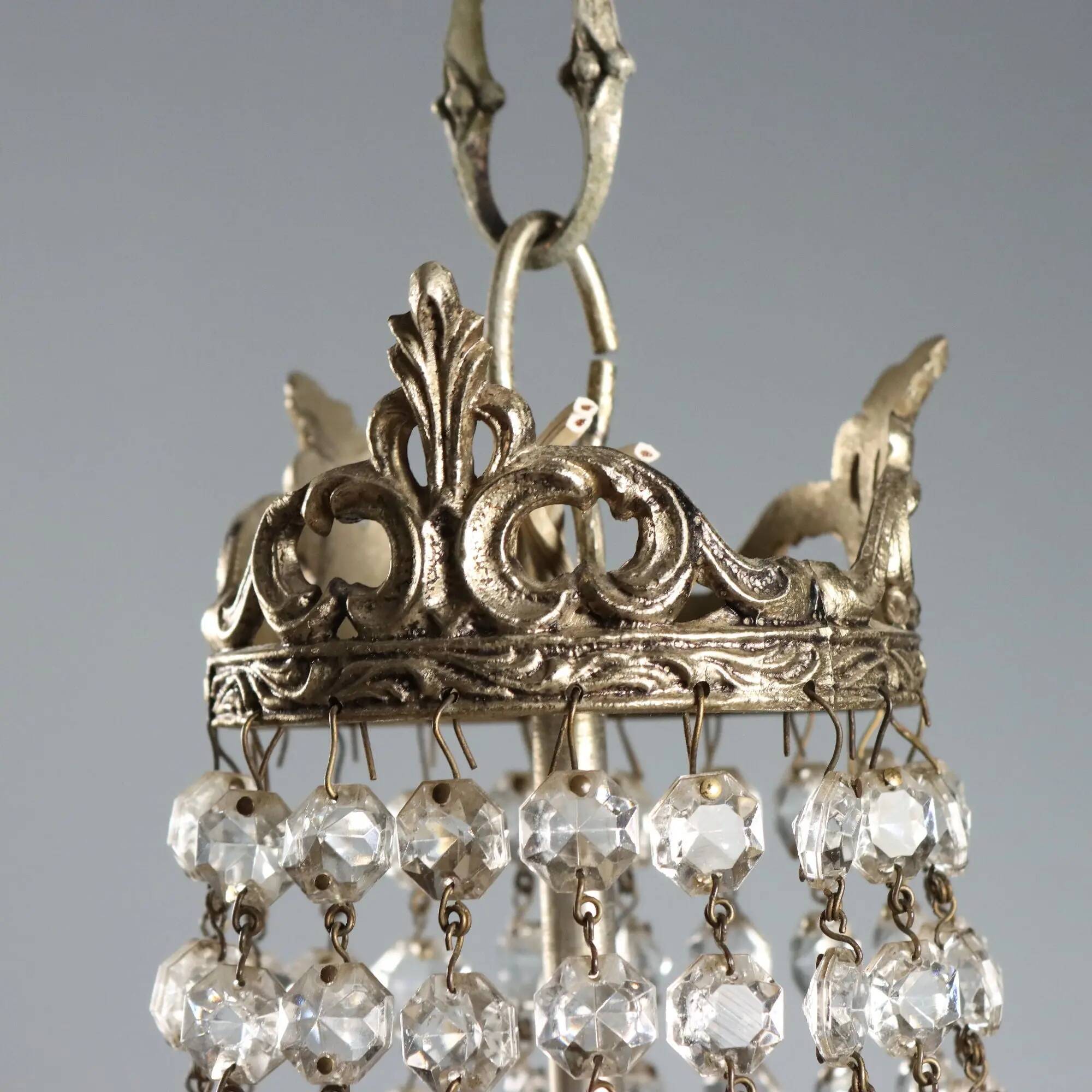 Antique chandelier in the shape of a balloon in silver-plated metal and glass, 20th century.