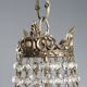 Antique chandelier in the shape of a balloon in silver-plated metal and glass, 20th century.