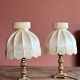 Fringed white bedside lamp