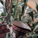 Antique hand-painted earthenware pitcher – Red and green floral decoration