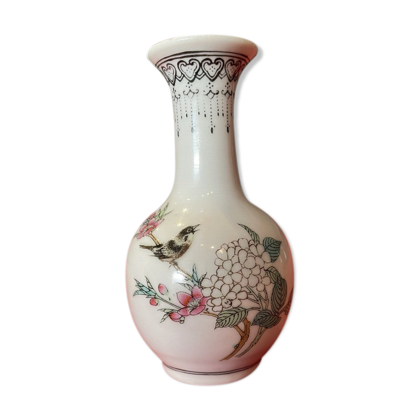 Porcelain vase decorated with flowers and birds