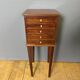 Louis XVI bedside table in mahogany with five drawers.