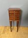 Louis XVI bedside table in mahogany with five drawers.