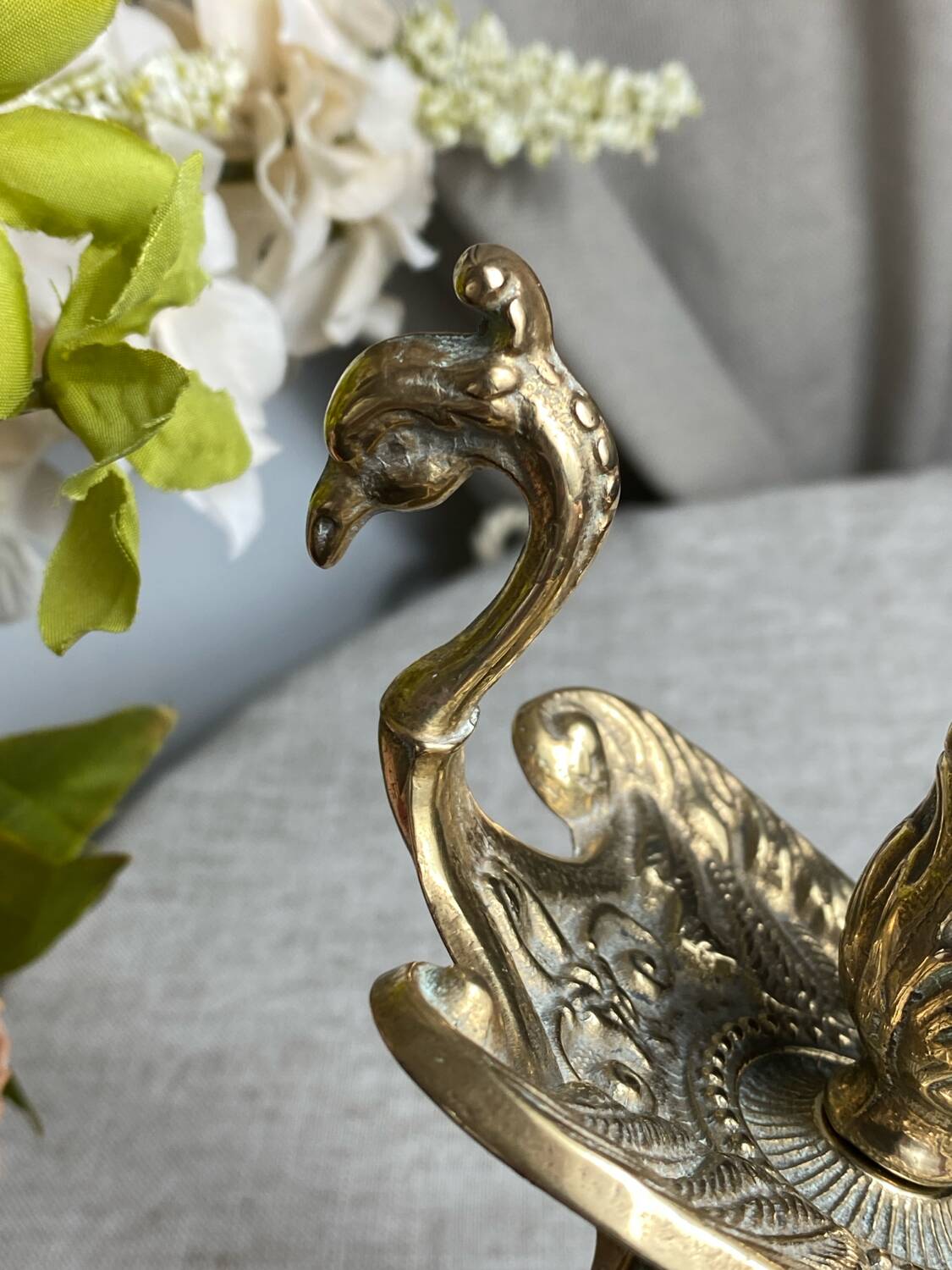 Bronze hand candlestick in the shape of a peacock