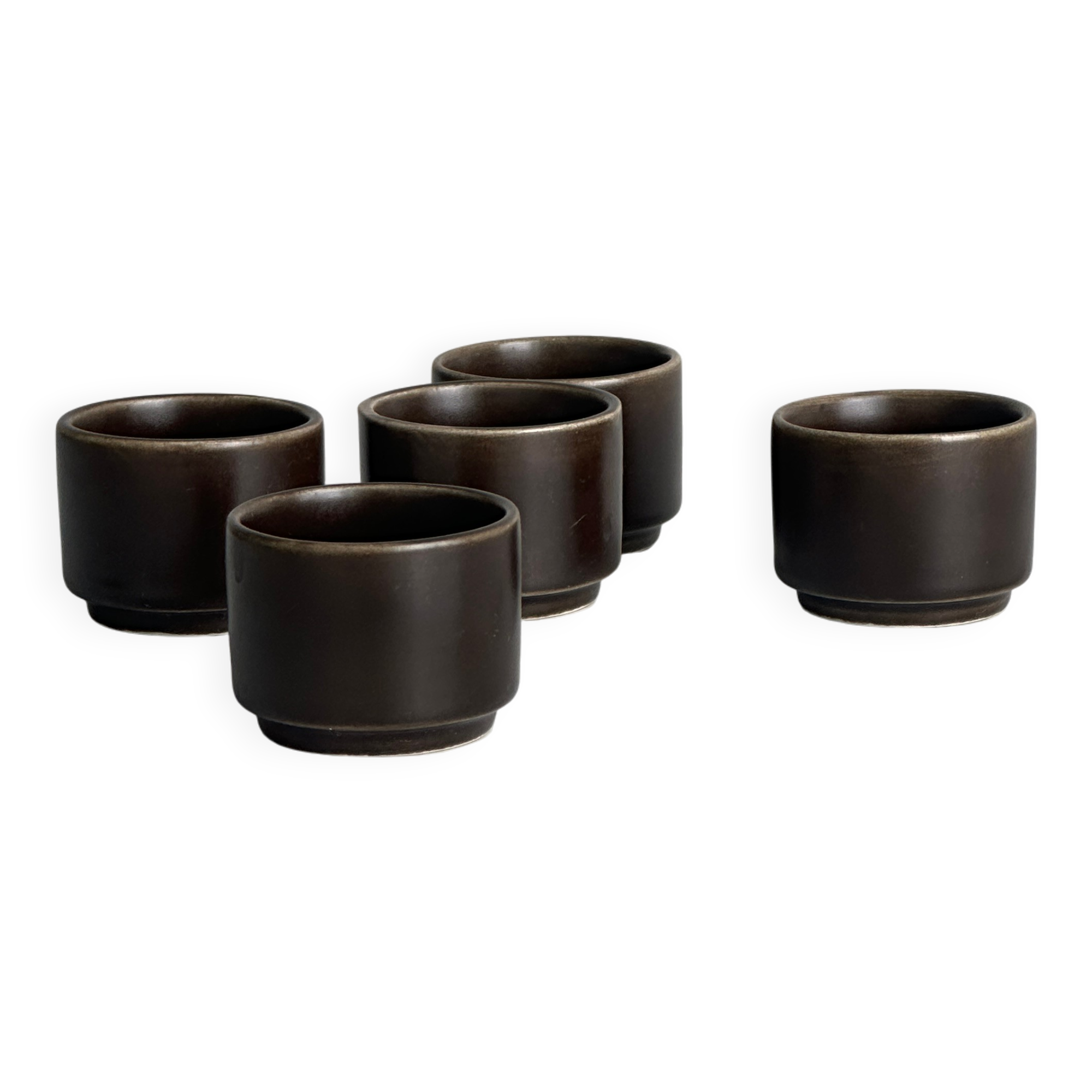 Set of 5 dark brown glazed ceramic egg cups.