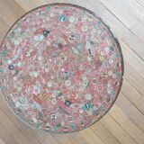 Small side table decorated with cigar rings under beveled glass