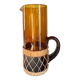 Vintage orange and wicker carafe