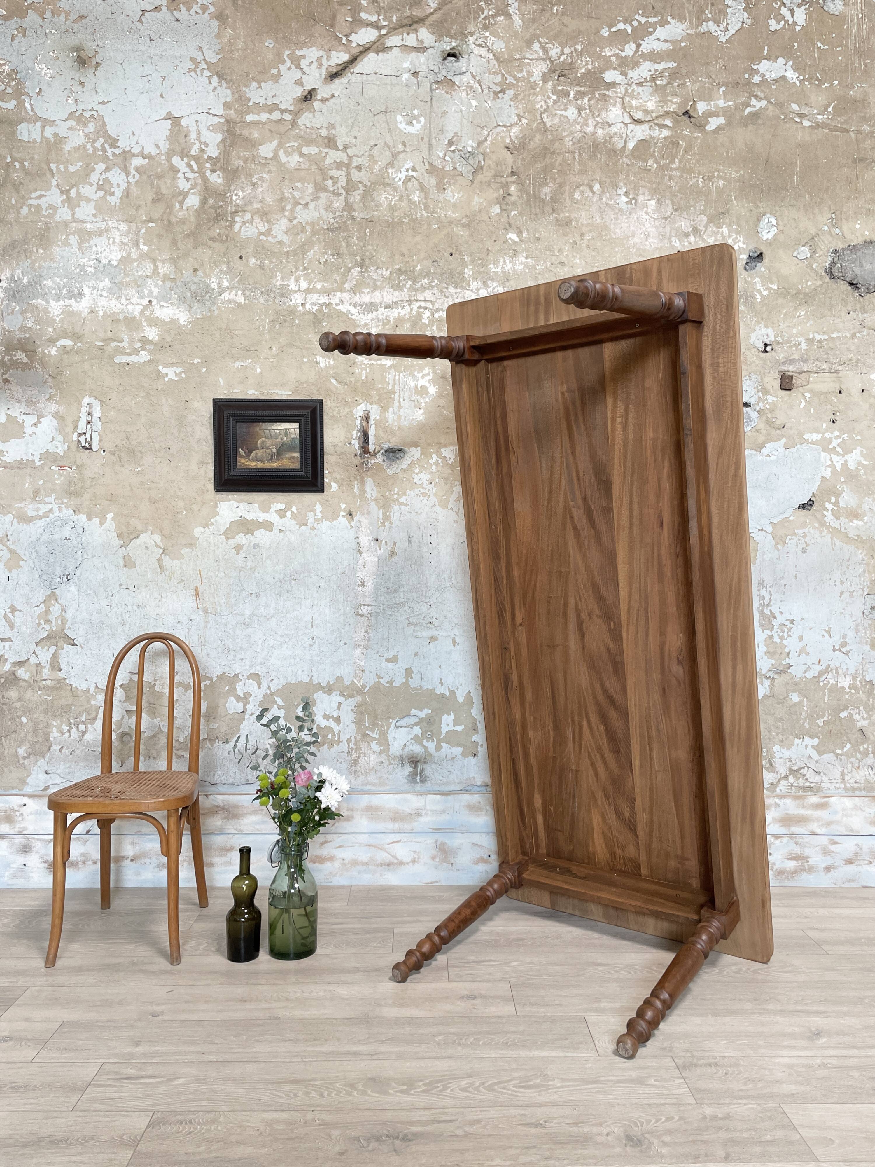 Vintage farmhouse table with turned legs.