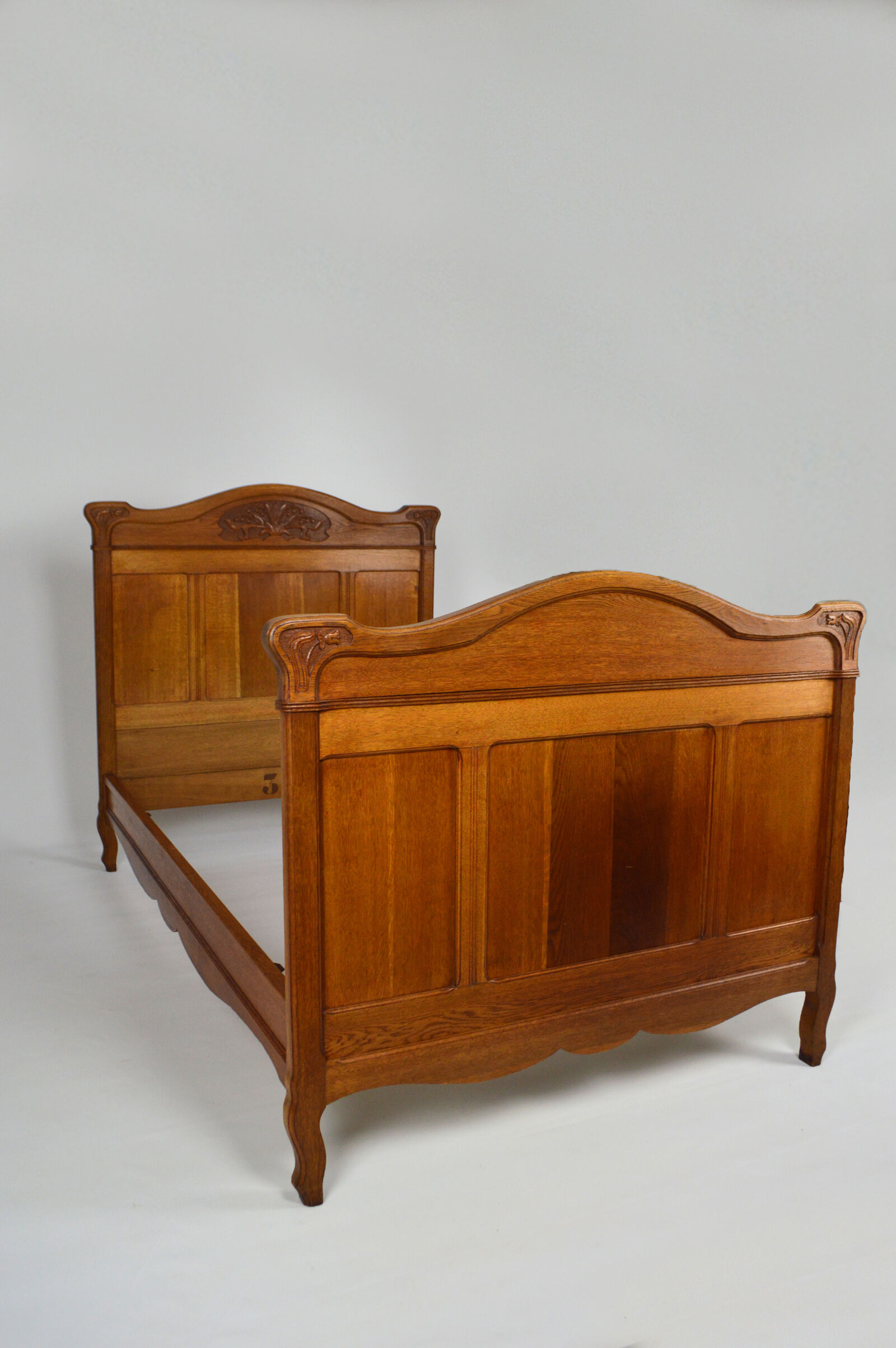 Art Nouveau twin beds in carved solid oak, France, circa 1910