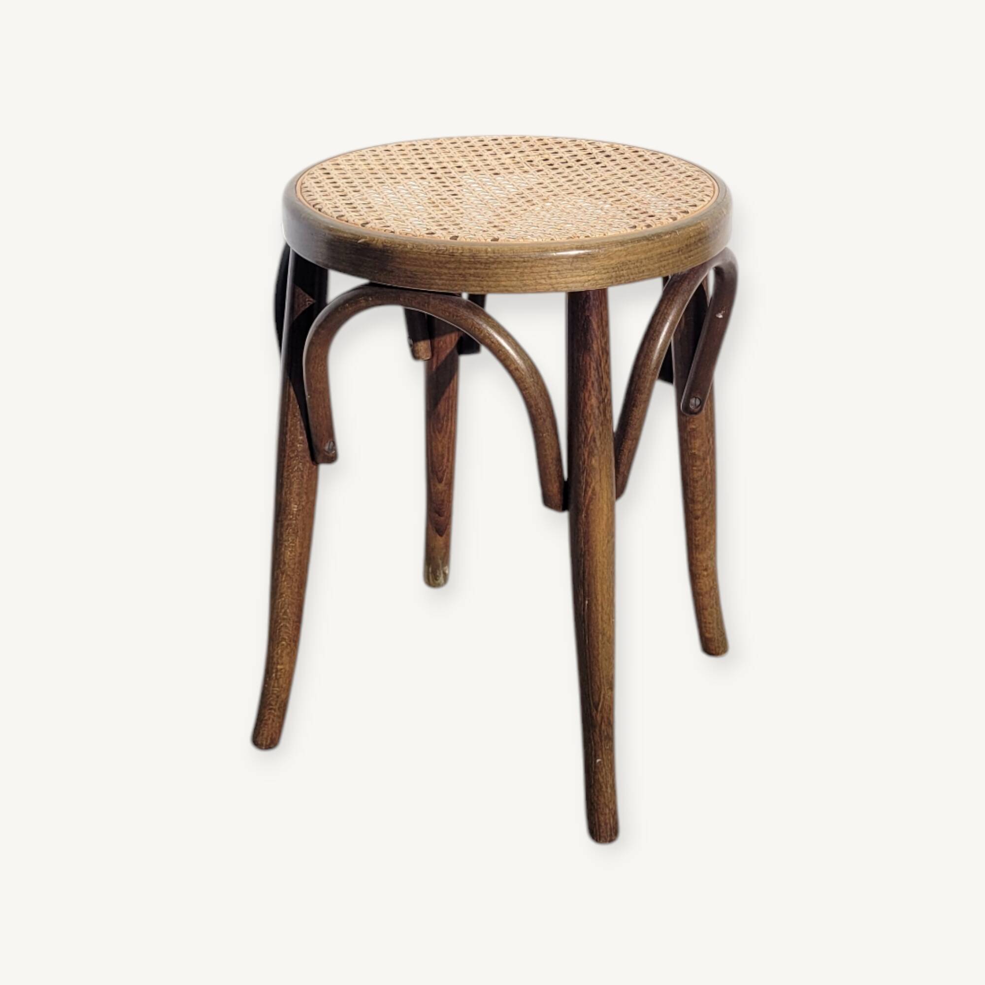Low stool in cane and curved wood