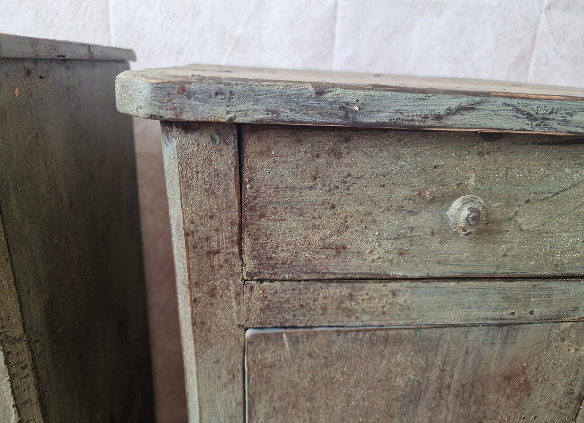 Pair of antique bedside tables with a green patina