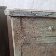 Pair of antique bedside tables with a green patina