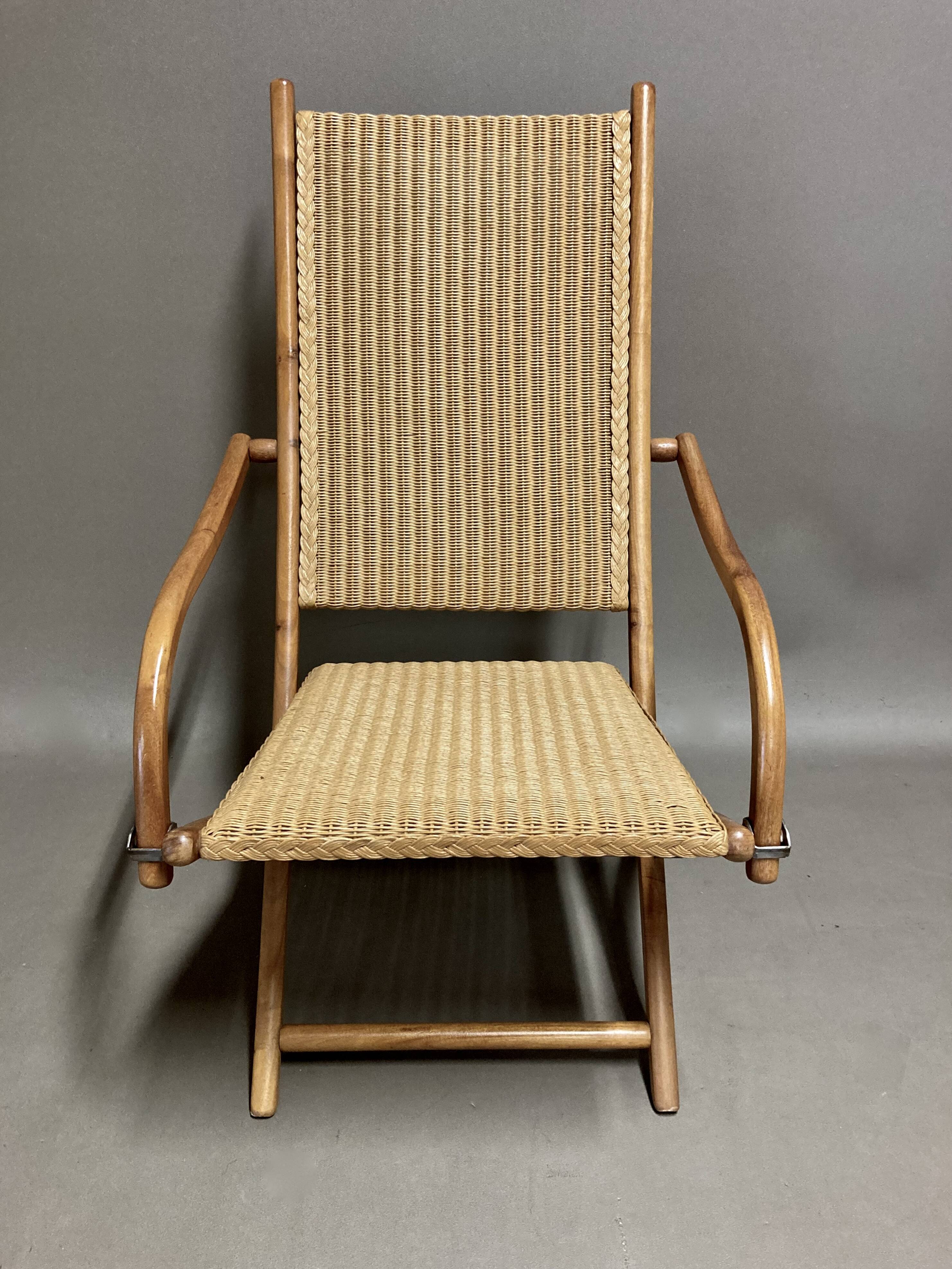 Foldable rattan armchair design 1960.