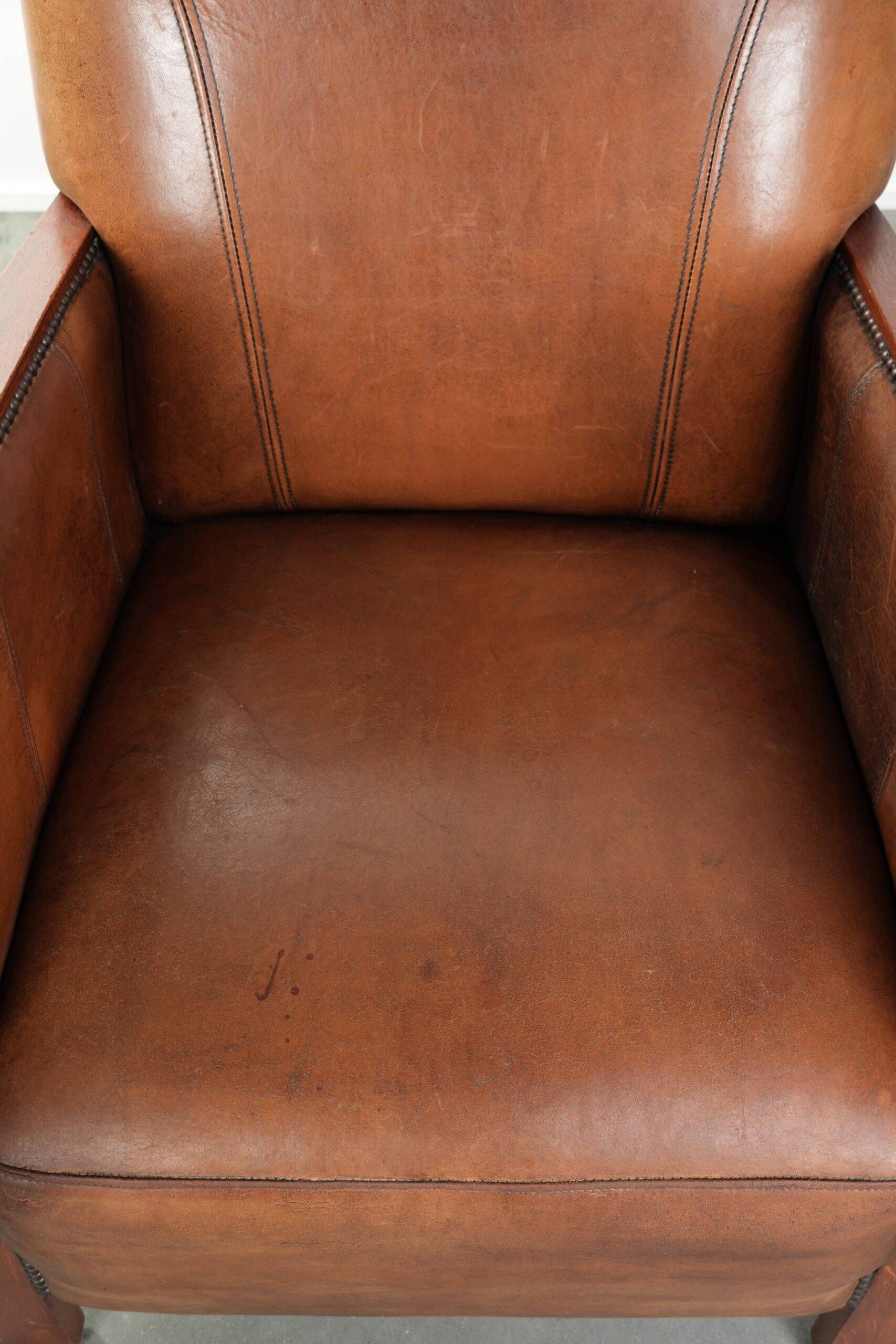 Sheepskin armchair in Art Deco style with wooden armrests