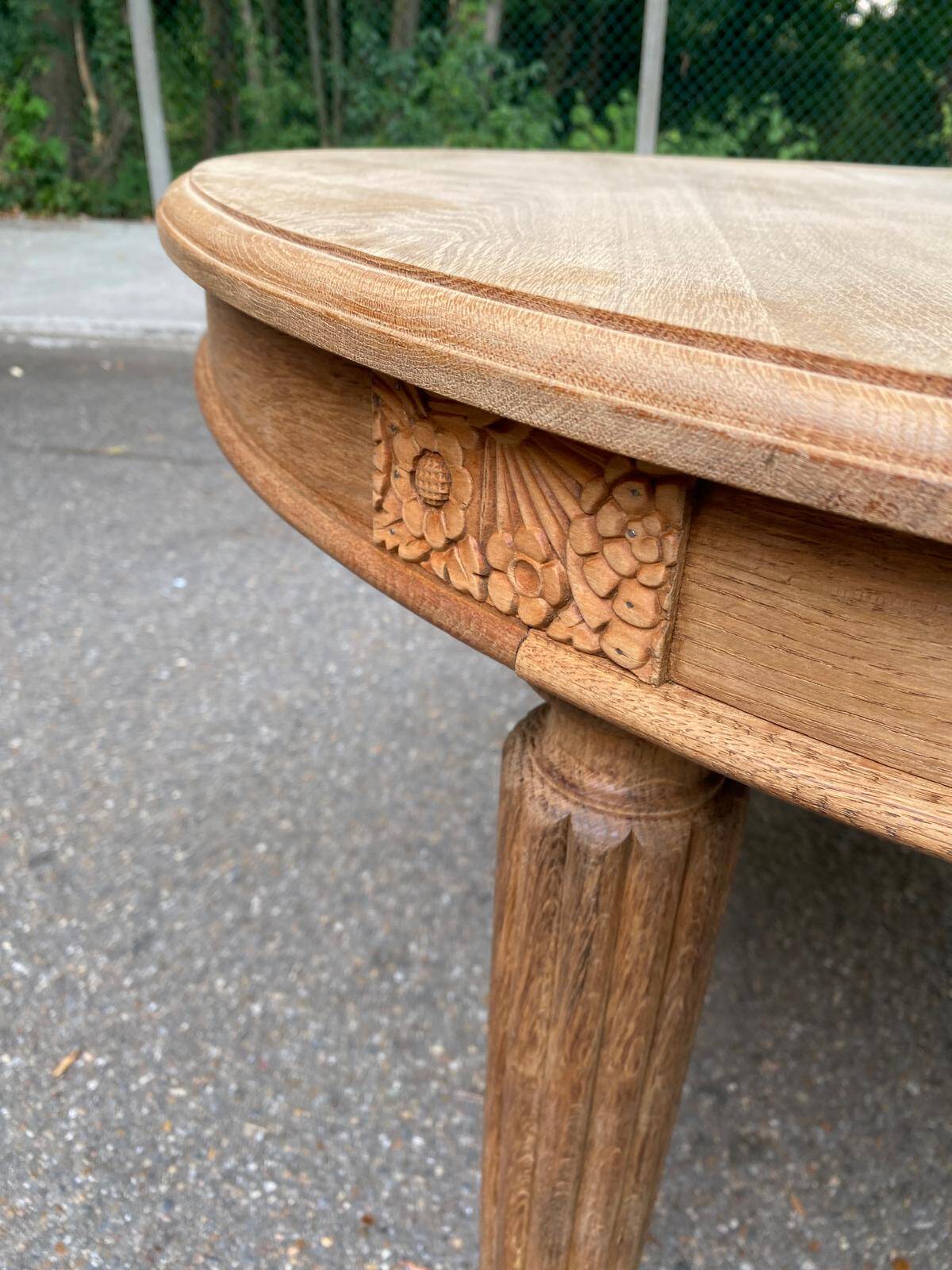 Large stripped solid oak dining table in Louis XVI style with 3 extensions.