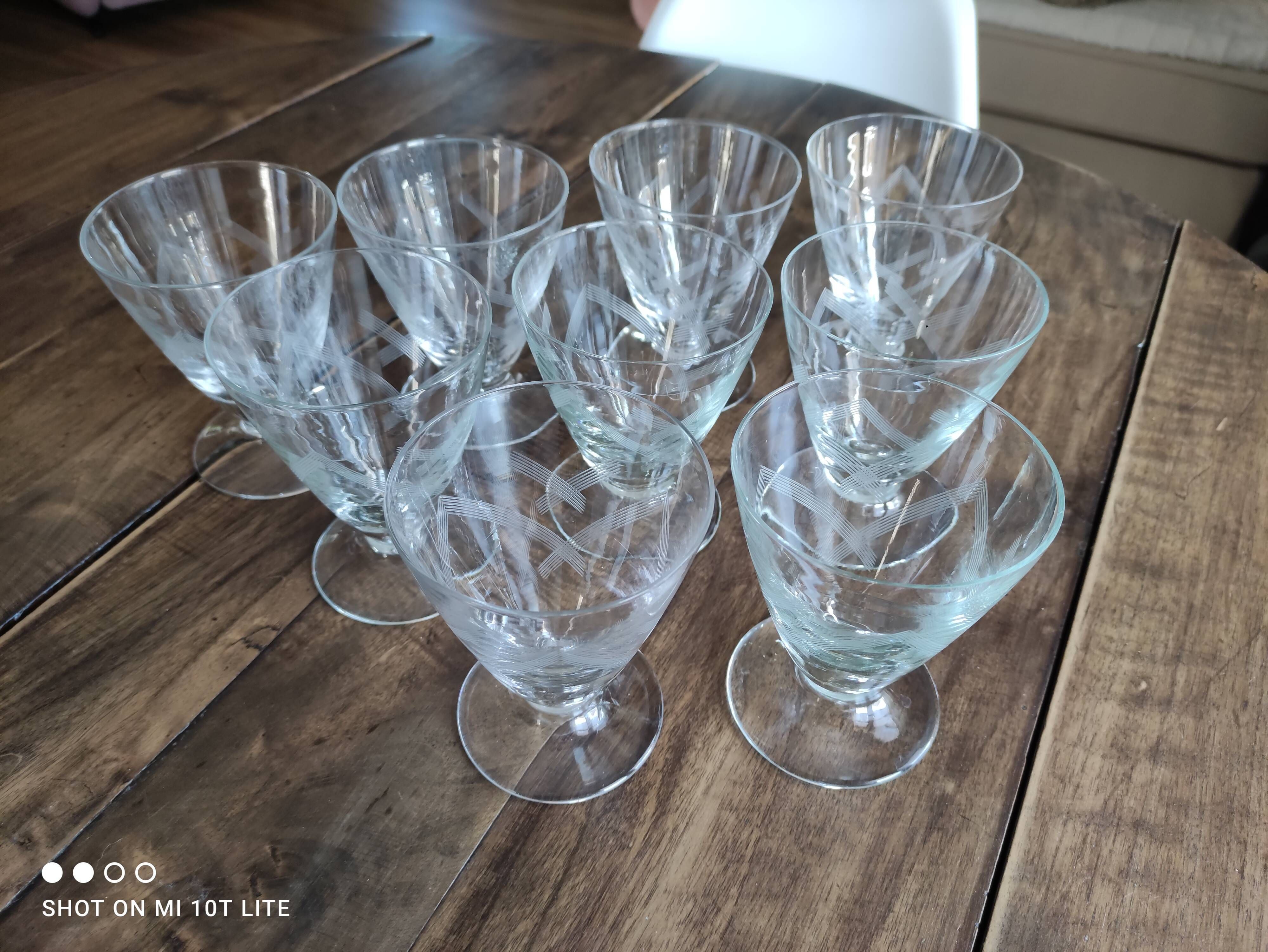 Set of 9 conical glasses on pedestal in antique chiseled glass crosses