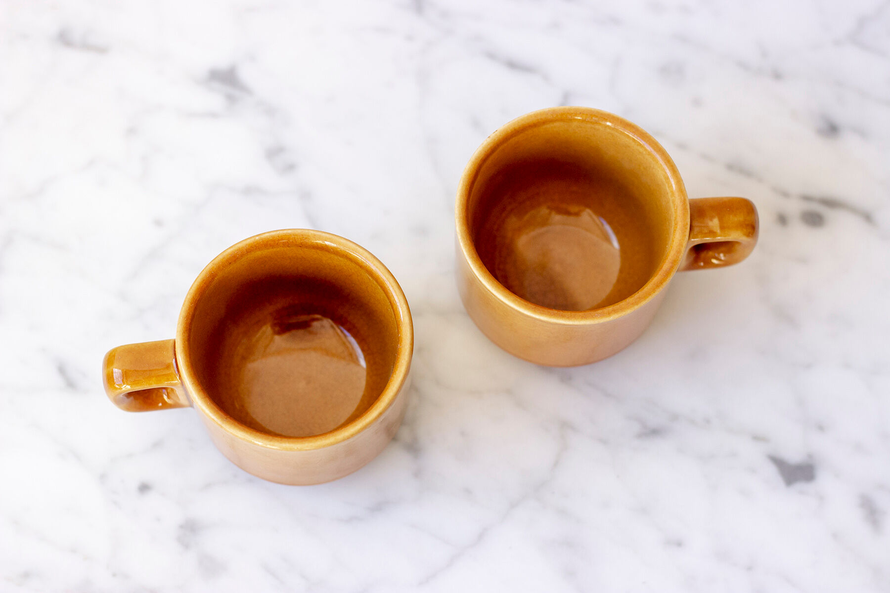 Pair of ochre yellow coffee cups