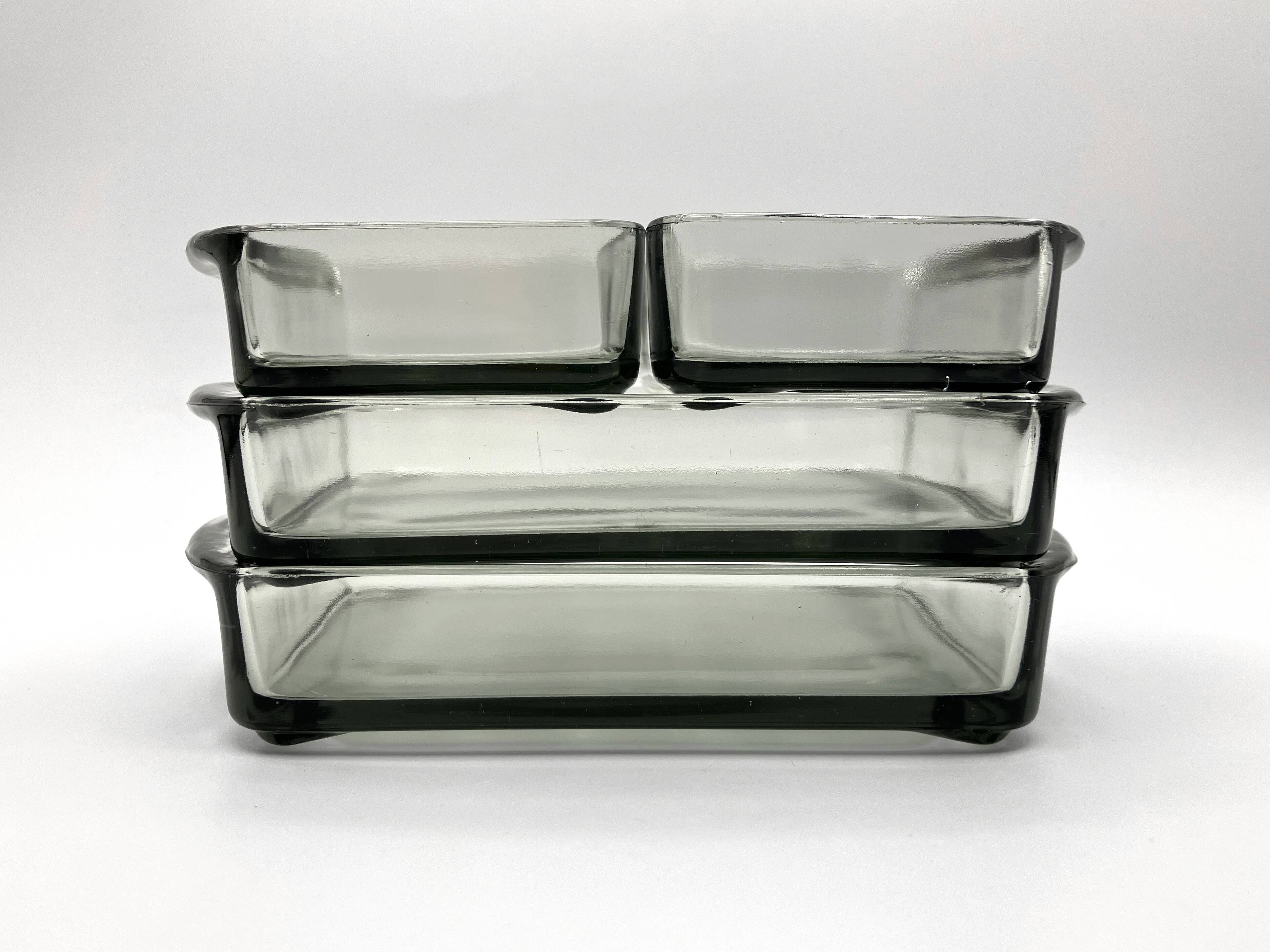 Teak tray and its 4 stackable glass dishes • Denmark • 1960