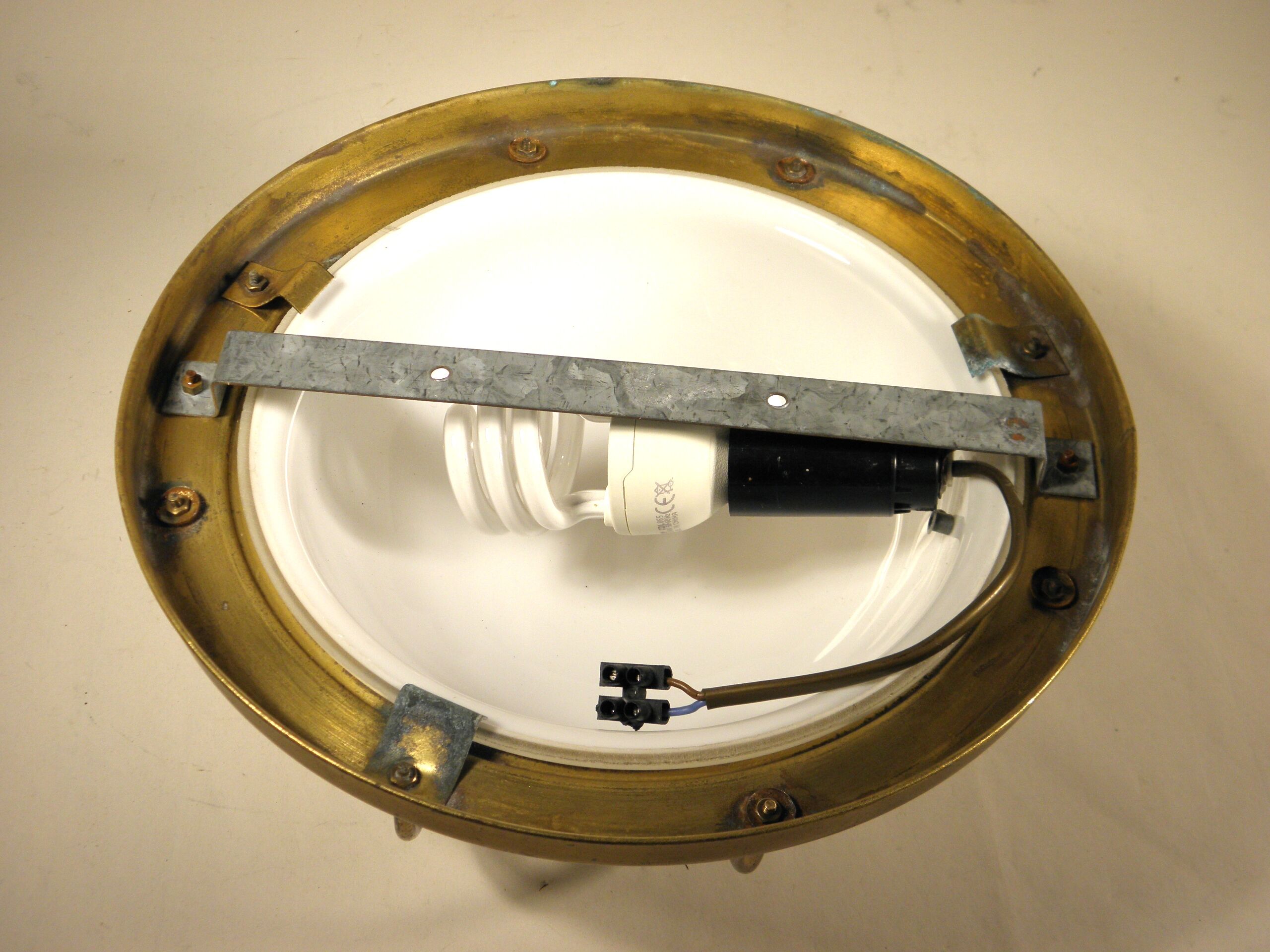 Brass "porthole" wall lamp