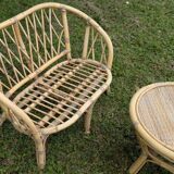 Set of children's rattan garden furniture from the 1950s and 1960s, including chairs, table, and bench.