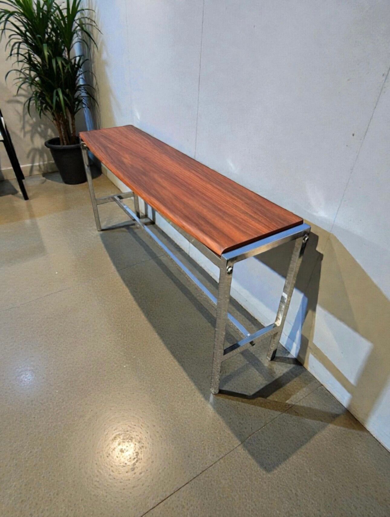 Curved base console in Scandinavian design – mahogany and chrome