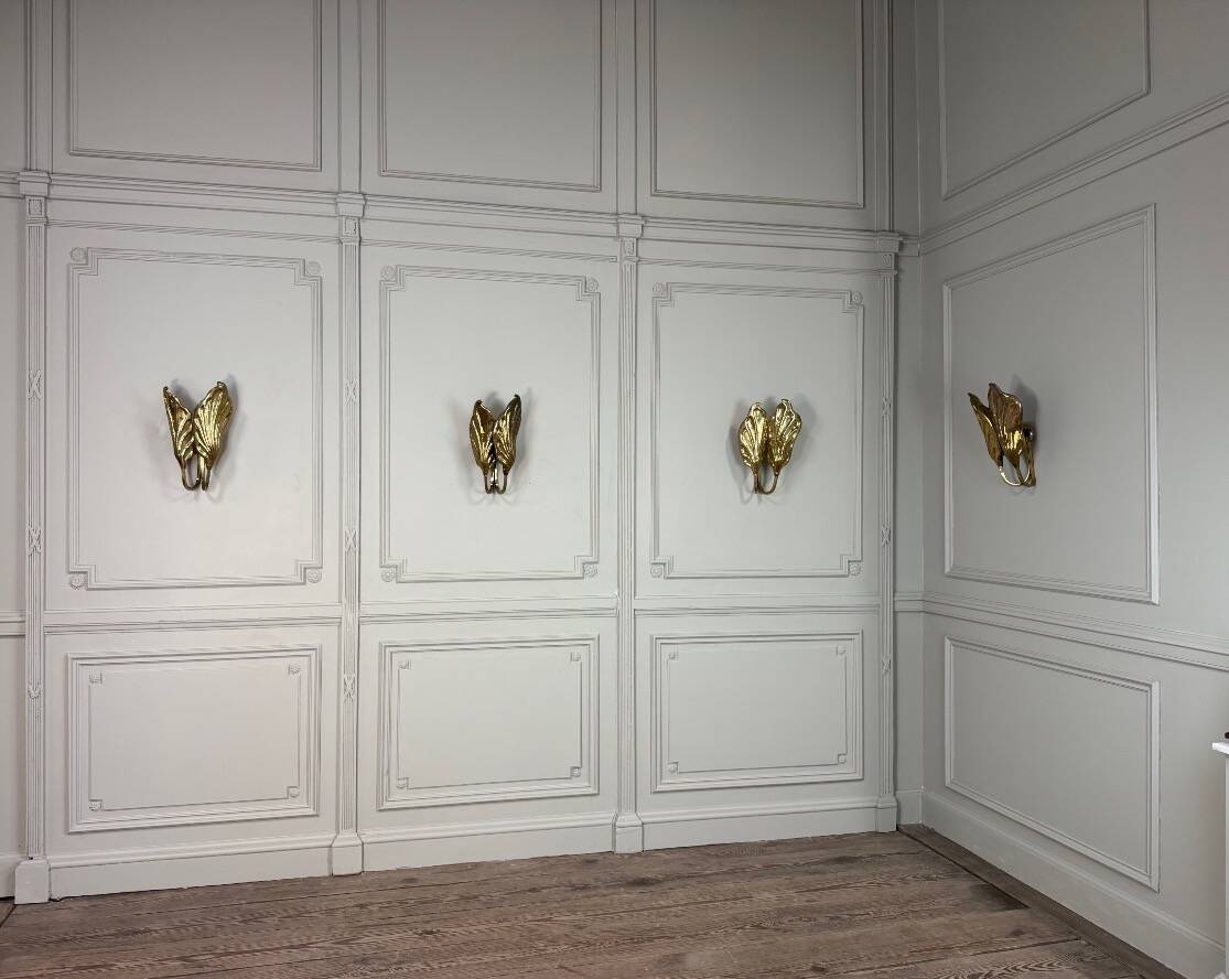 Set of four gilt brass wall lights, Tommaso Barbi, circa 1960.