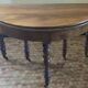 Beautiful antique half-moon table in walnut with its 4 extensions.