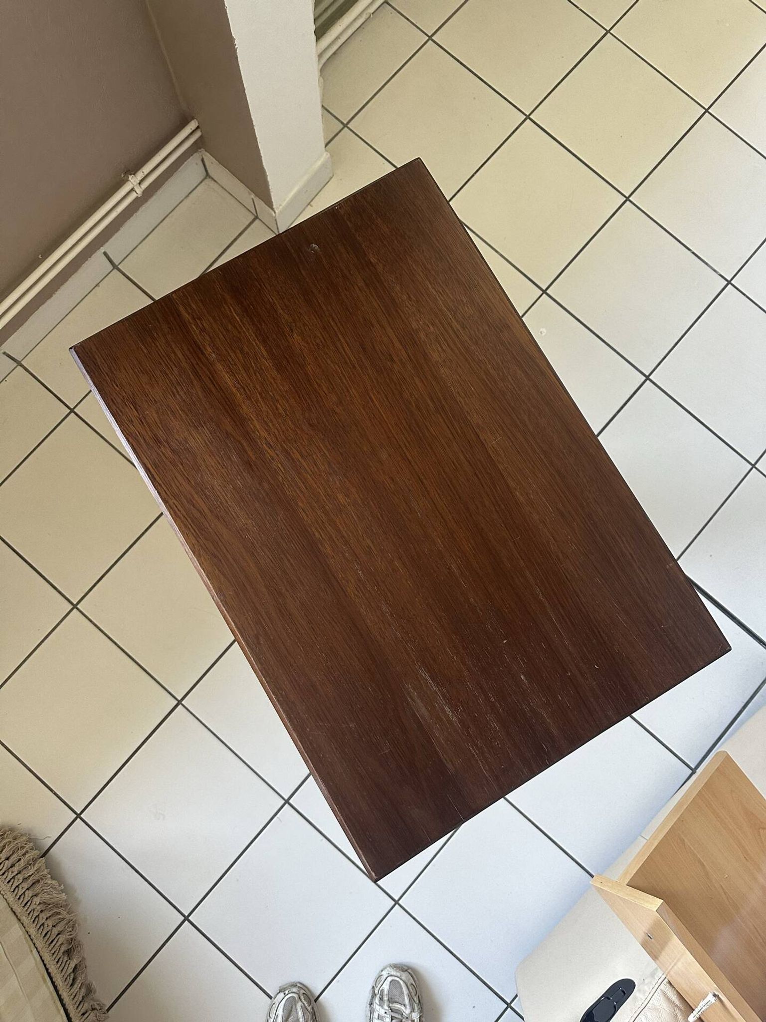 Small wooden bistro table with a turned central leg.