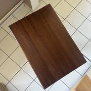 Small wooden bistro table with a turned central leg.