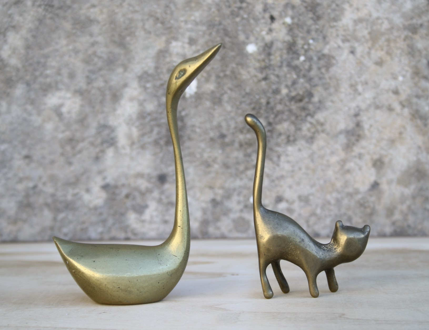 Cat and brass swan