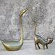 Cat and brass swan