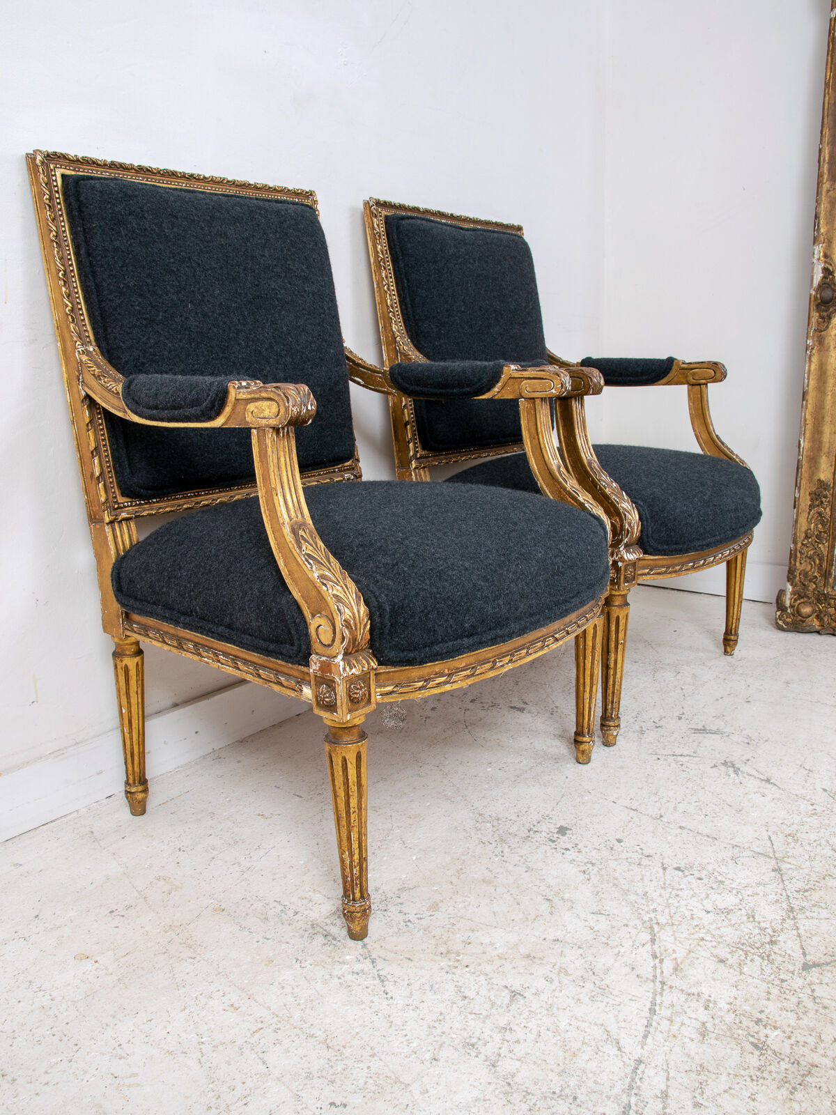 Pair of 19th century Louis XVI gilt armchairs newly re upholstered in holland and sherry fabric
