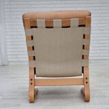 Fauteuil norvégien des années 1970, modèle "Kengu", cuir de meuble.