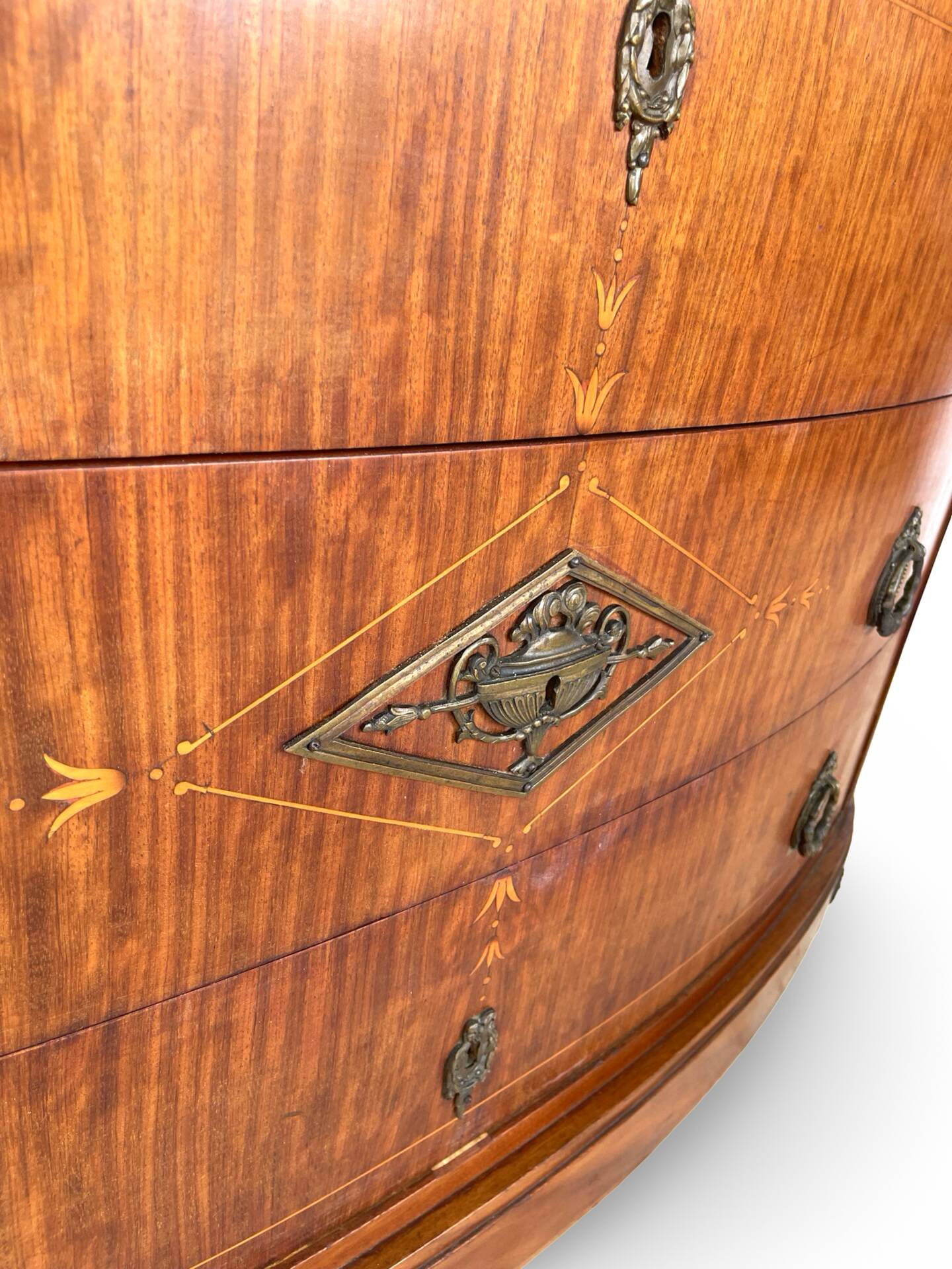 The demi-lune commode/ chest of drawers