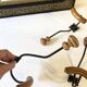 Trio of antique wooden and metal coat hooks