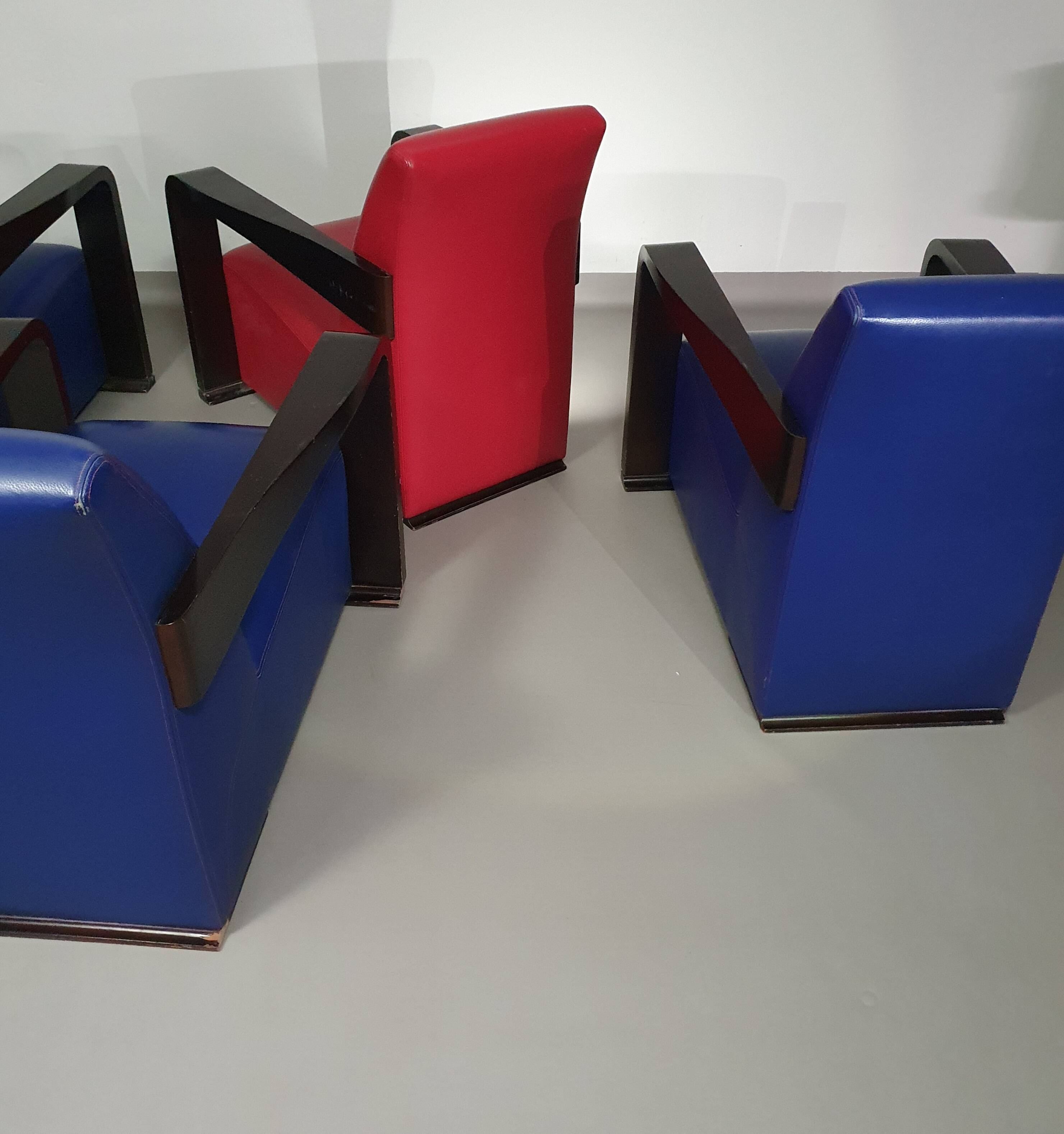 4 x Vintage Ying lounge chairs / fauteuils van Hugues Chevalier,'90. 3 x blue / 1 x red leather