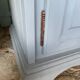 Robust country sideboard with country charm with marble handles in gray and white chalk