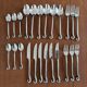 Vintage 24-piece stainless steel cutlery set with spiral handles