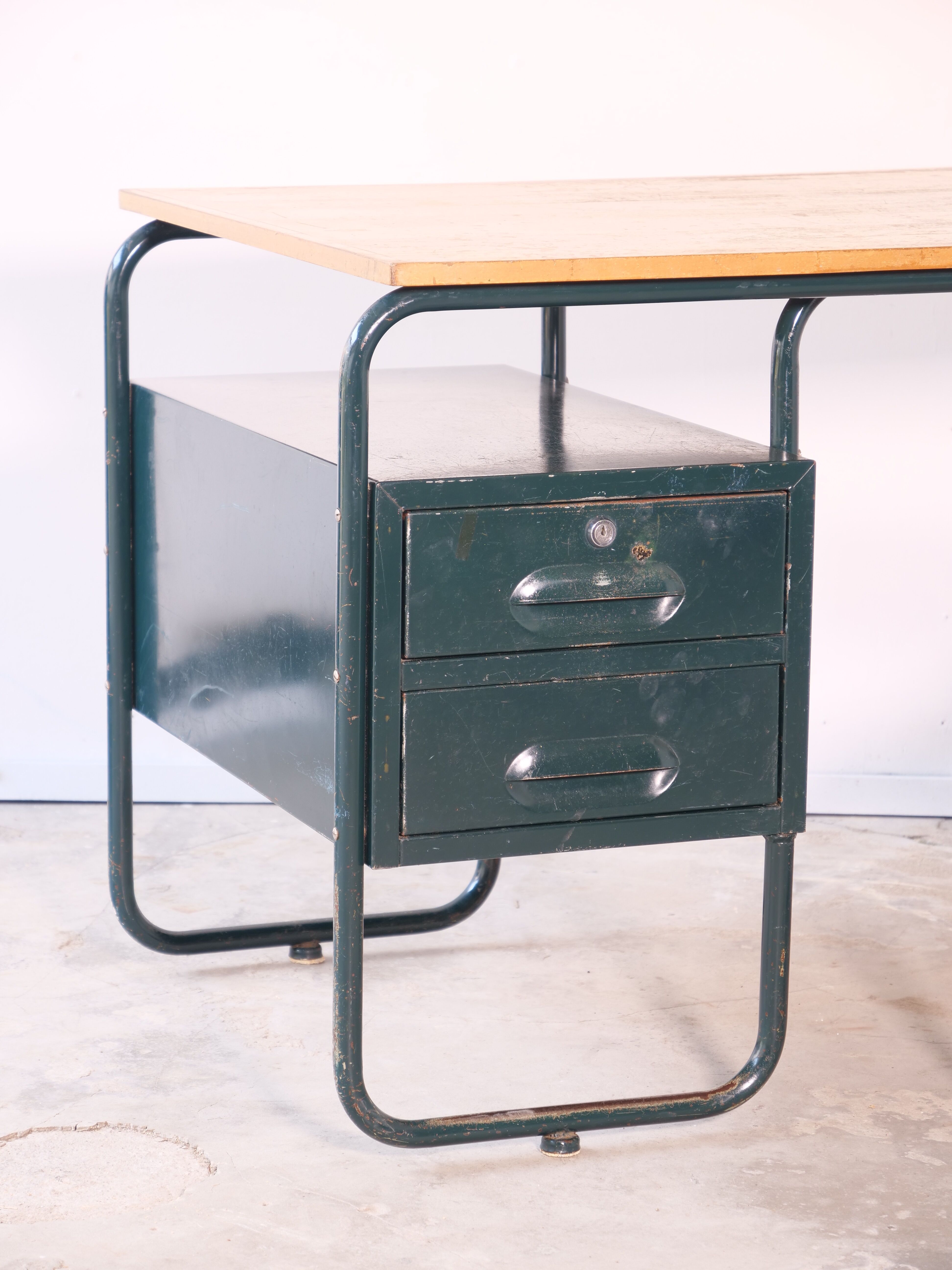 Desk with bauhaus style tubular steel chair