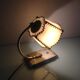 Brass bedside lamp and beige lampshade art deco style